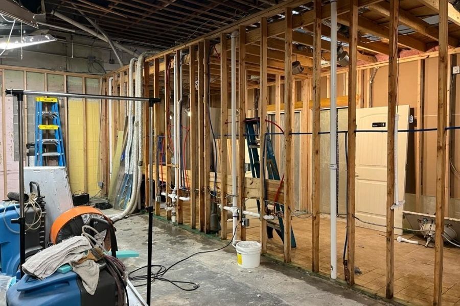 Professional reconstruction work restoring a home after water damage